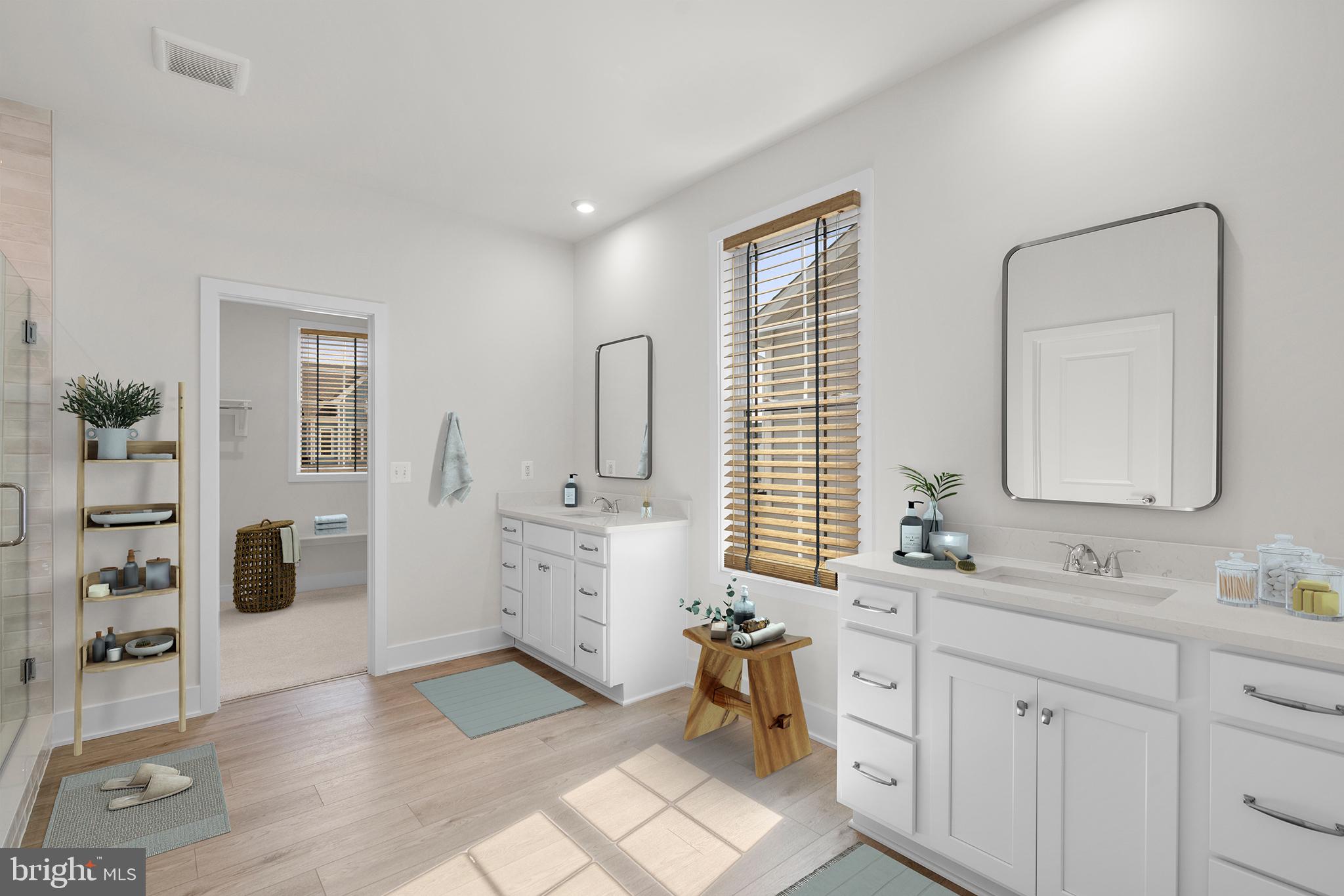 100 Alabaster Lane Stephenson, VA 22656 - Photo 6 of 44 a bathroom with a double vanity sink a mirror and a bathtub