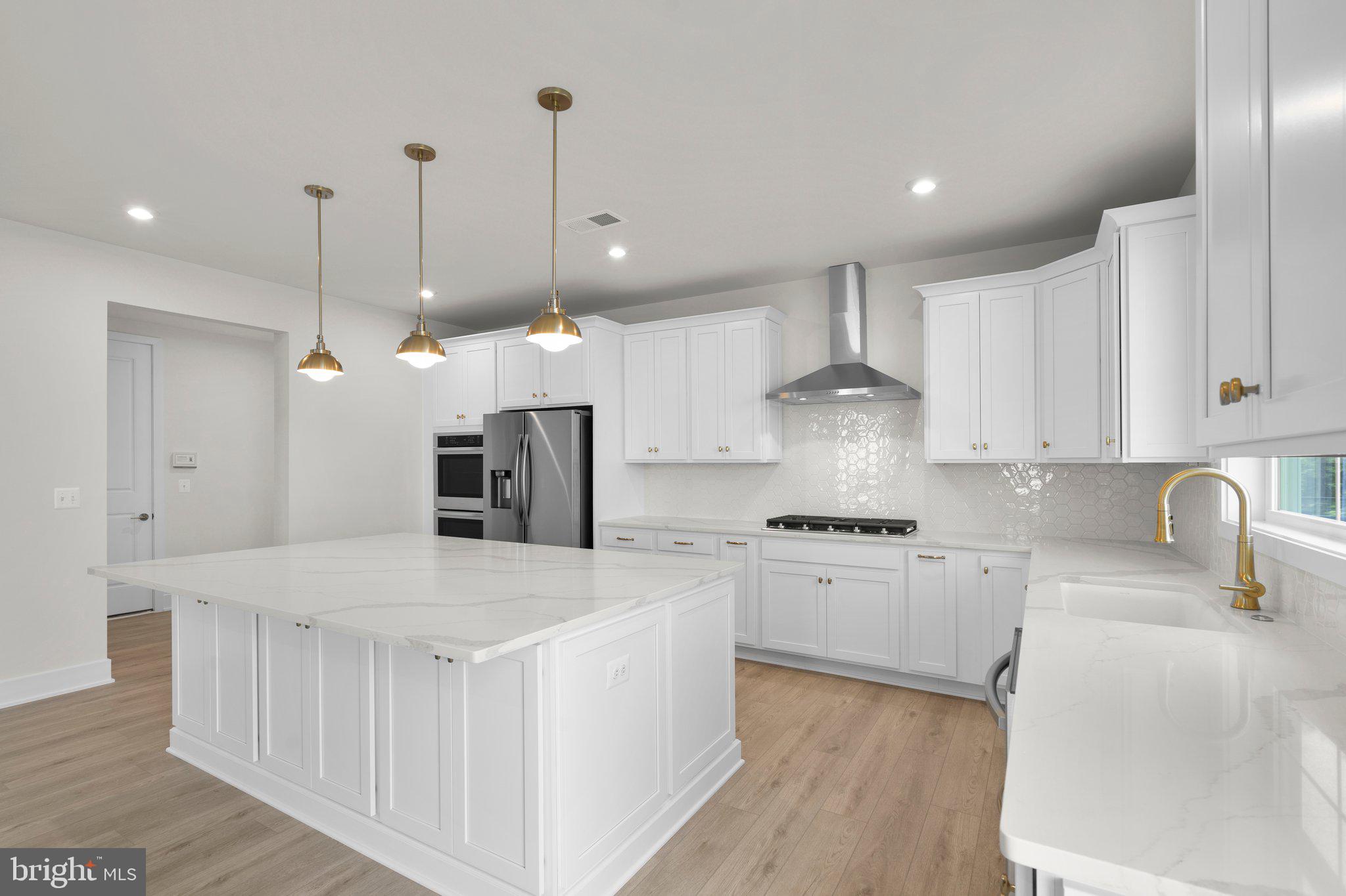 100 Alabaster Lane Stephenson, VA 22656 - Photo 9 of 44 a kitchen with stainless steel appliances granite countertop a sink a stove and a refrigerator