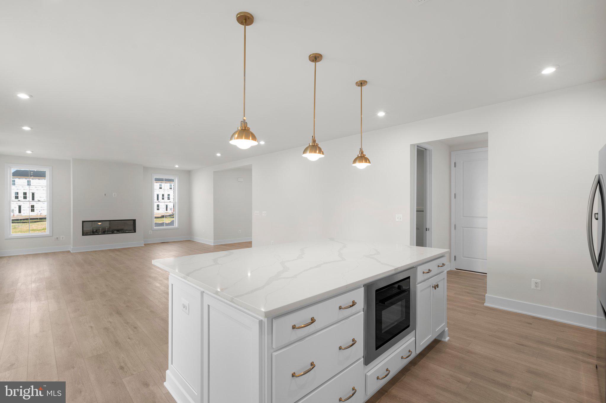 100 Alabaster Lane Stephenson, VA 22656 - Photo 10 of 44 a kitchen with a stove and a wooden floor