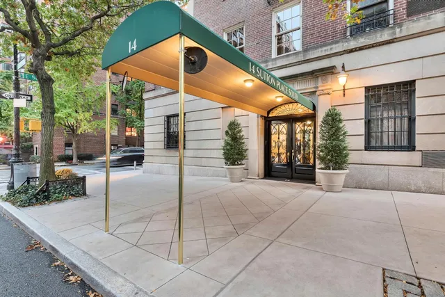 a view of a building with sitting area