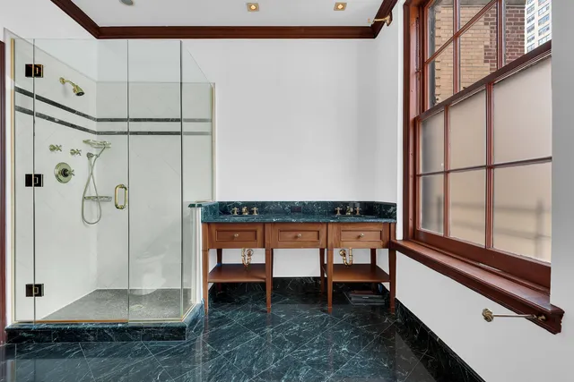 a balcony with chairs and door