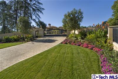 Undisclosed Address Bradbury, CA 91008 - Photo 2 of 19 a view of a house with a big yard and potted plants