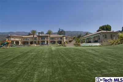 Undisclosed Address Bradbury, CA 91008 - Photo 5 of 19 a front view of a house with a garden