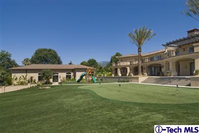 Undisclosed Address Bradbury, CA 91008 - Photo 6 of 19 a front view of a house with a garden