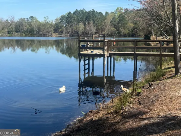 a view of a lake with a big yard