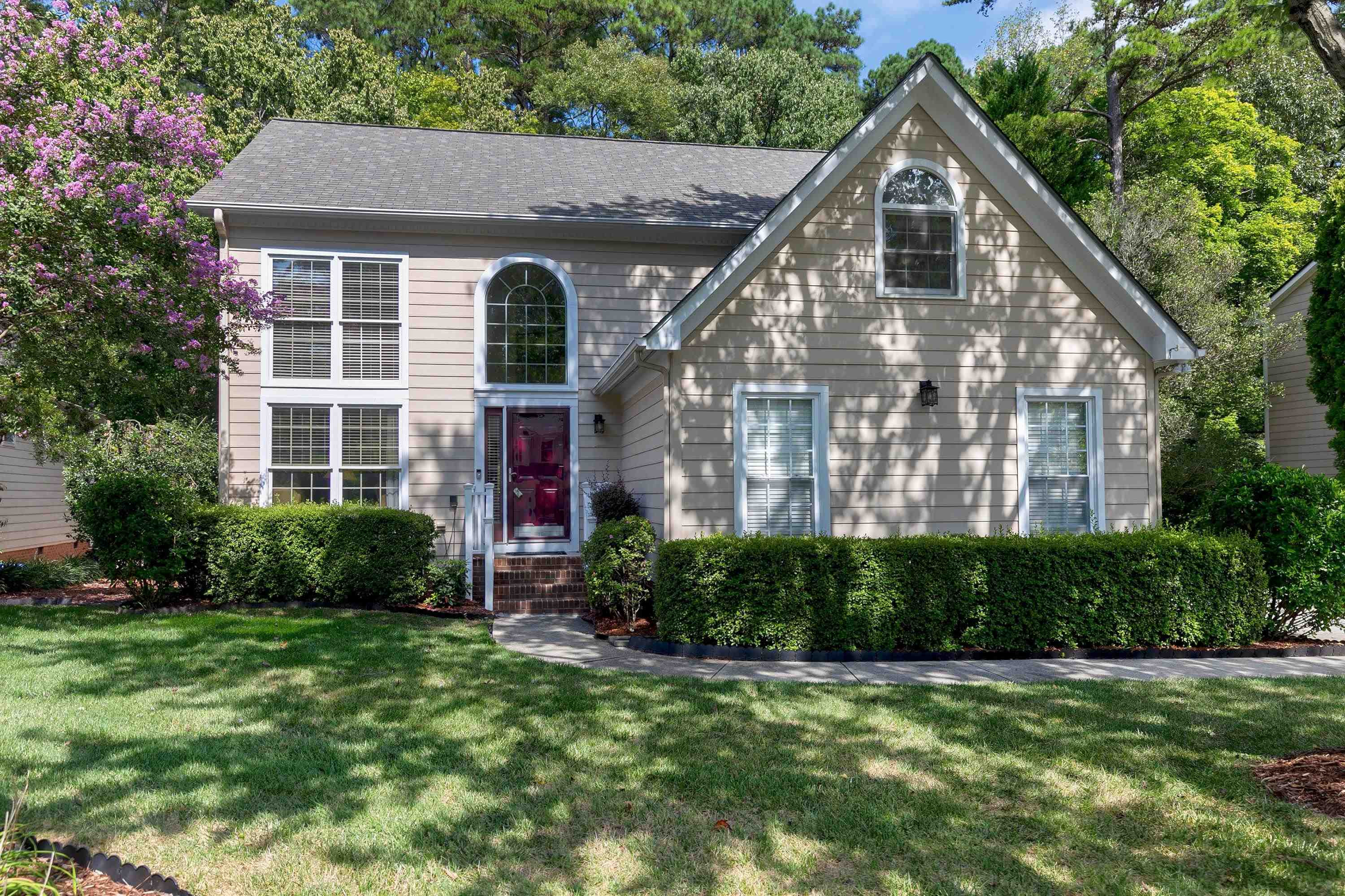 a front view of a house with a yard