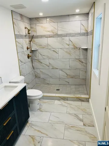 a bathroom with a shower and a toilet