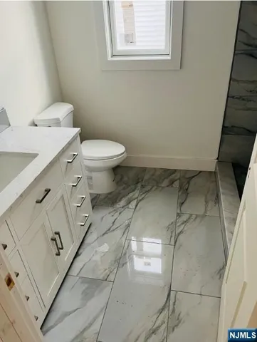 a bathroom with a sink and a toilet