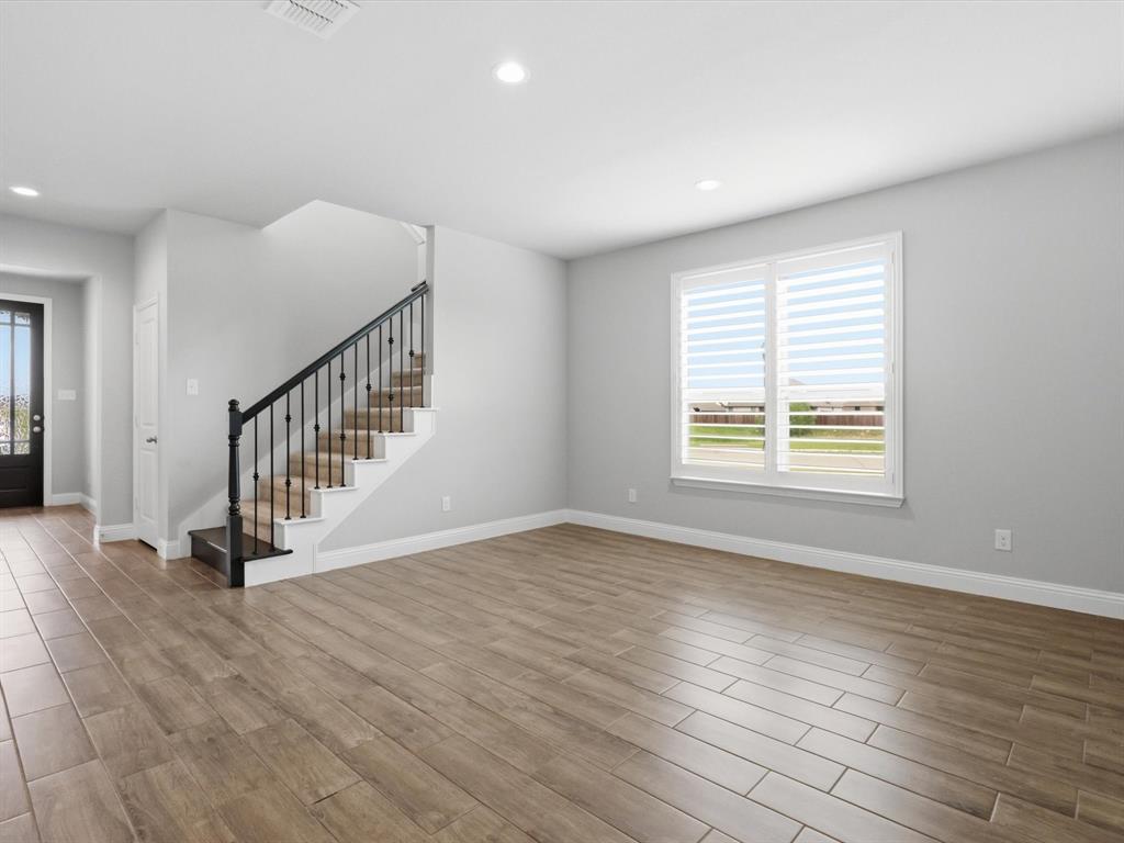 1601 Radecke Road Krum, TX 76249 - Photo 32 of 32 wooden floor in an empty room with a window