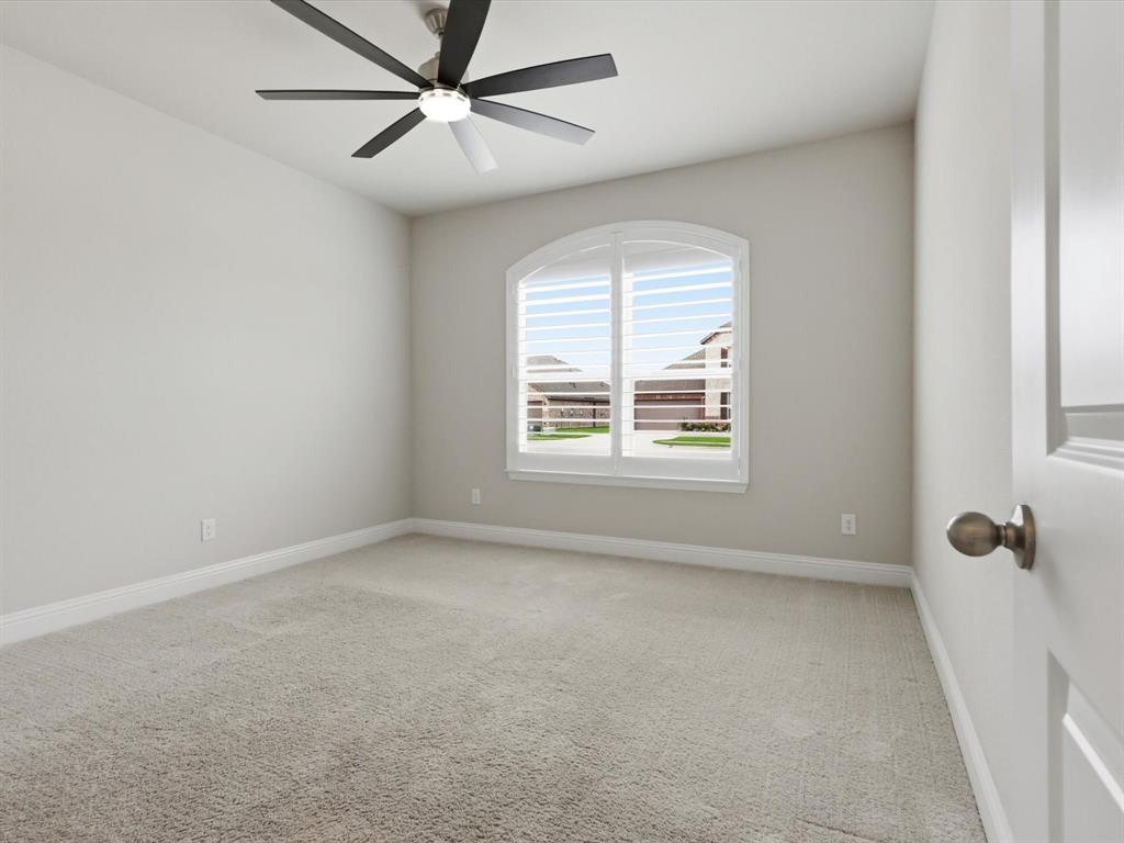 1601 Radecke Road Krum, TX 76249 - Photo 21 of 32 an empty room with windows and fan
