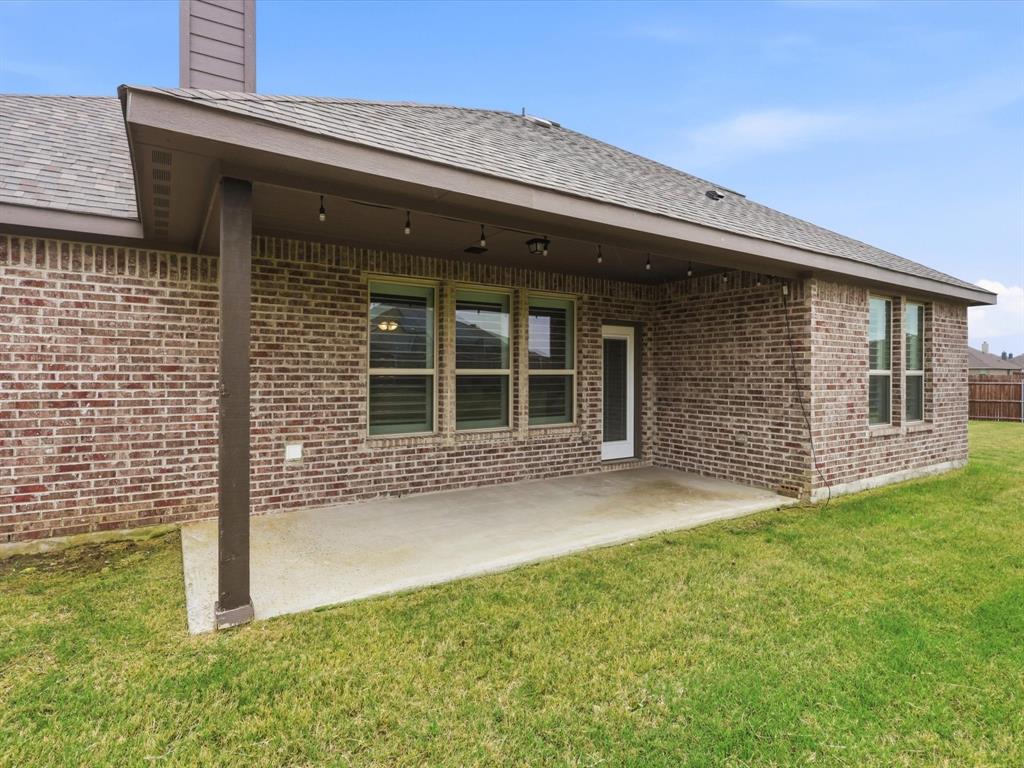1601 Radecke Road Krum, TX 76249 - Photo 29 of 32 front view of a house with a yard