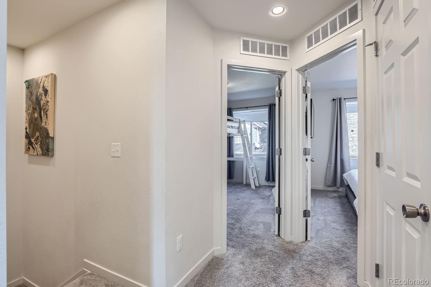 5266 Central Park Boulevard Denver, CO 80238 - Photo 20 of 23 a view of a hallway with wooden floor and entryway