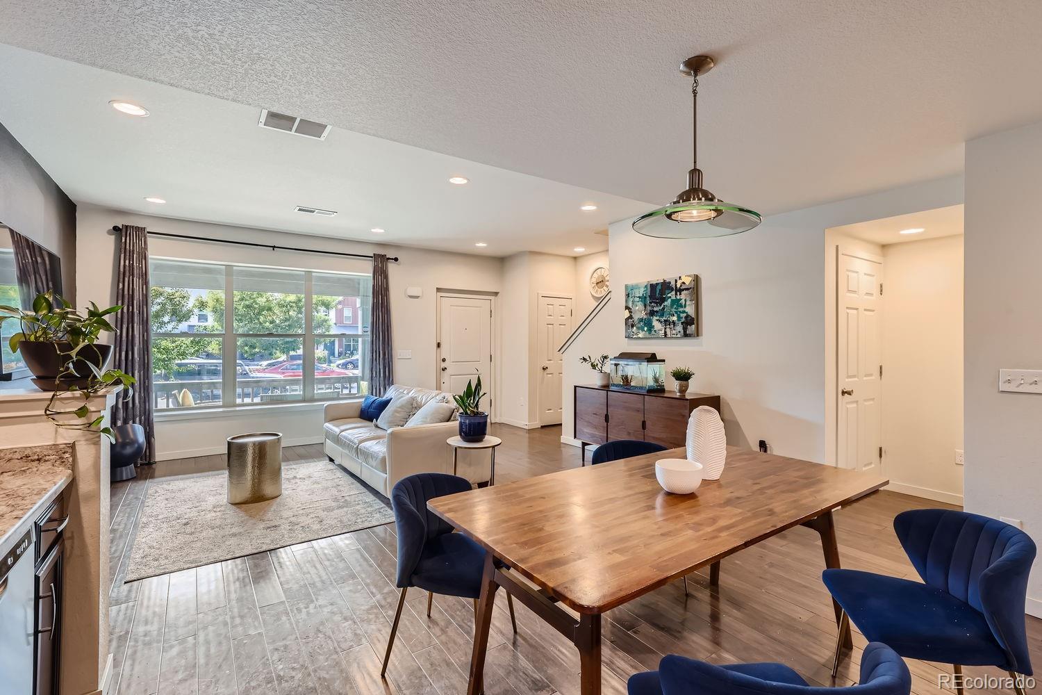 5266 Central Park Boulevard Denver, CO 80238 - Photo 10 of 23 a living room with furniture a window and a table