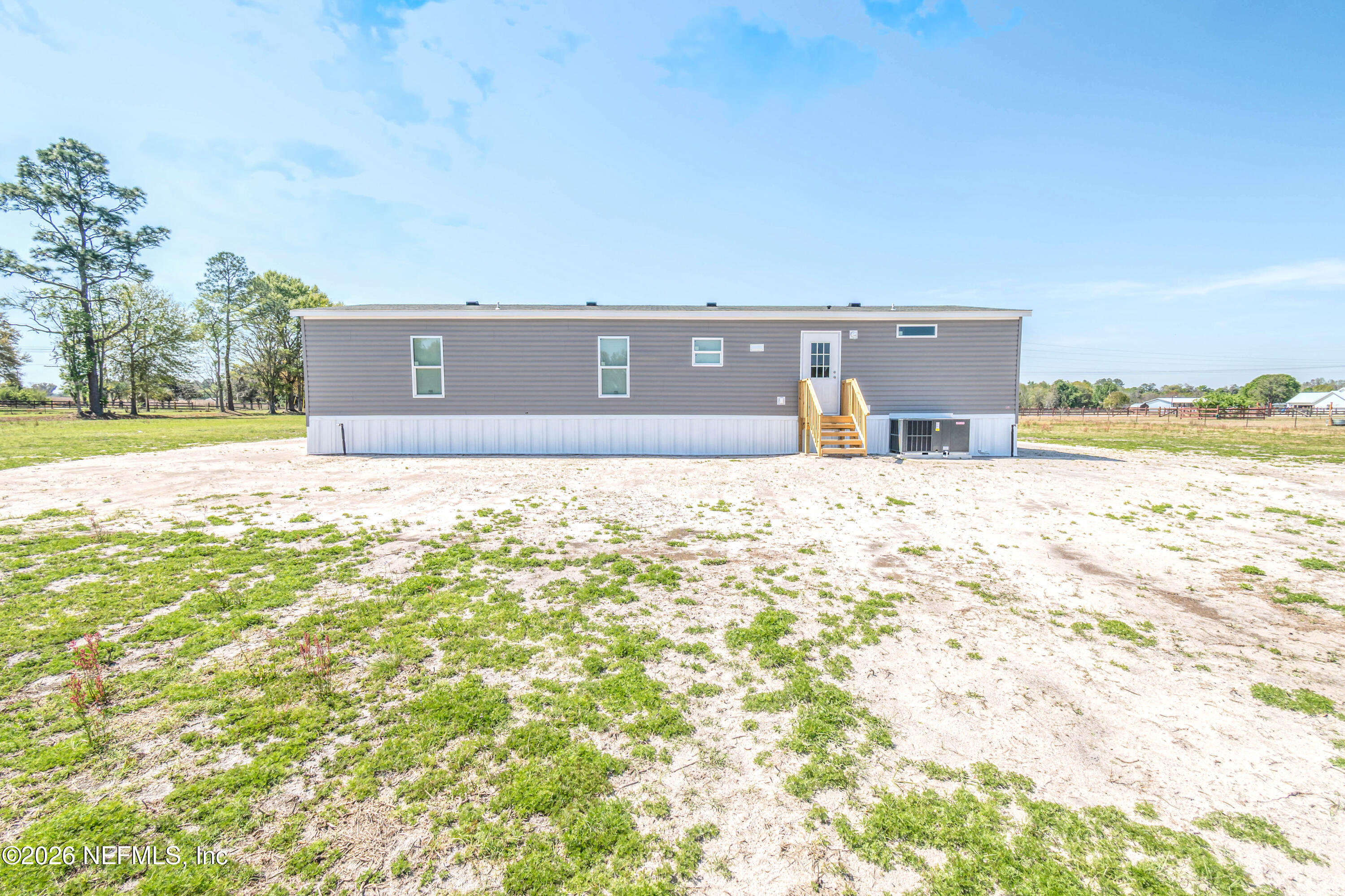 6171 Bill Davis Road Glen St. Mary, FL 32040 - Photo 23 of 28 a view of a swimming pool with an outdoor space and seating area