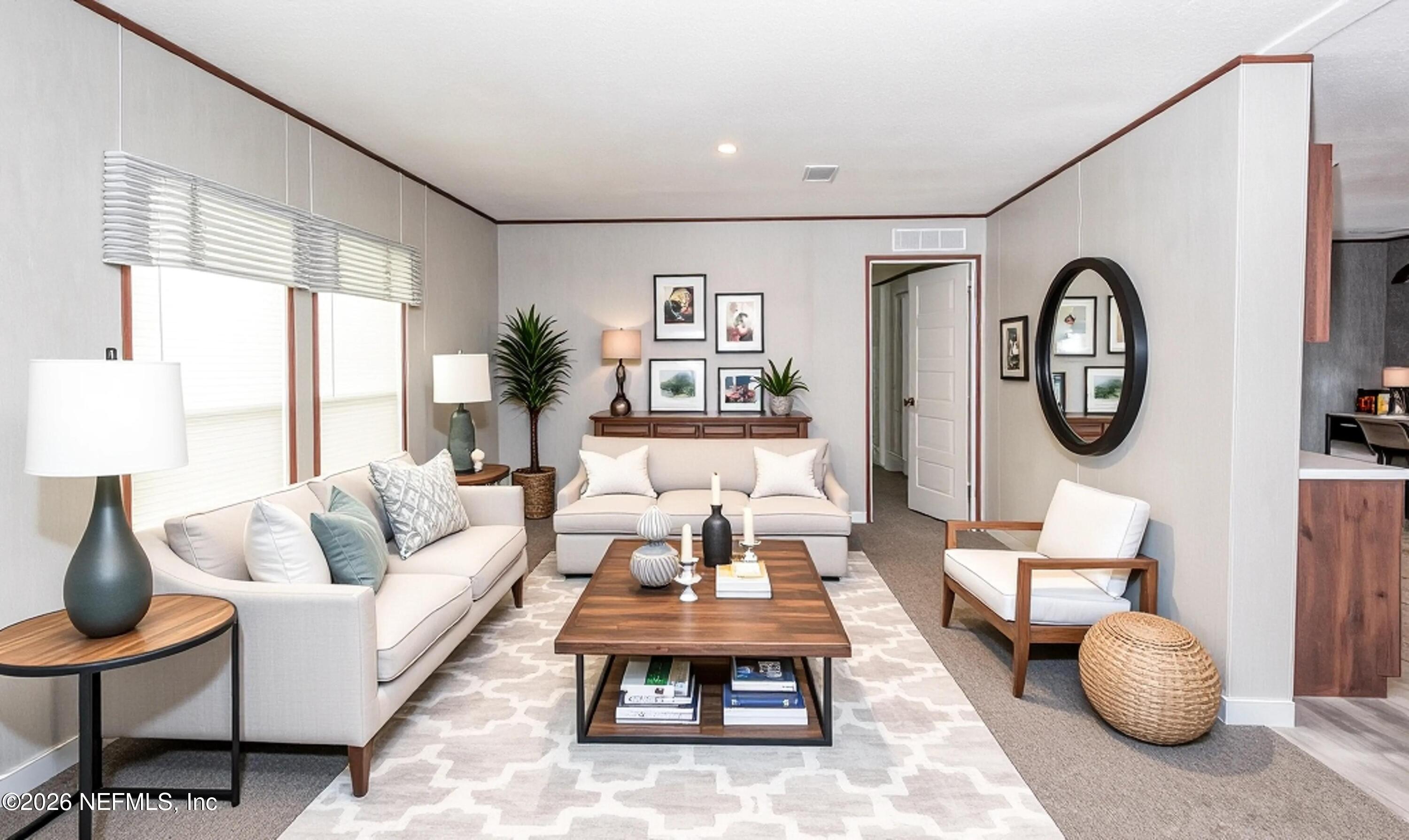 6171 Bill Davis Road Glen St. Mary, FL 32040 - Photo 3 of 28 a living room with furniture and a large window
