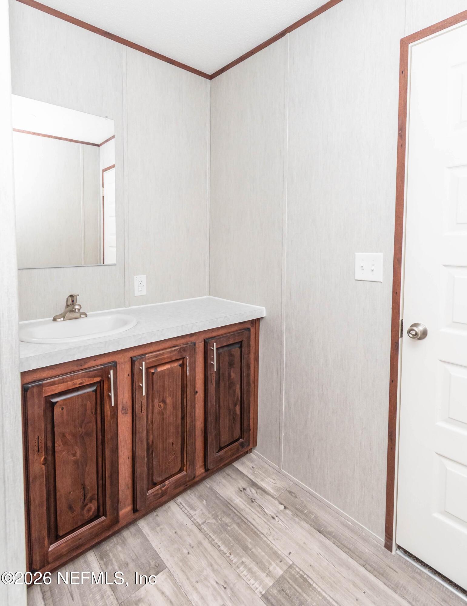 6171 Bill Davis Road Glen St. Mary, FL 32040 - Photo 9 of 28 a bathroom with a sink and a mirror