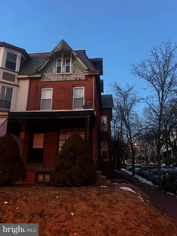 a front view of a house with yard