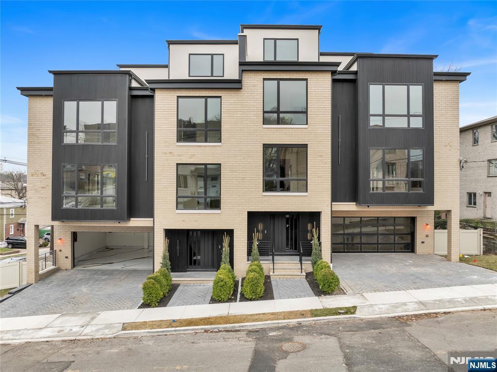 2220 MacKay Avenue, Unit A Fort Lee, NJ 07024 - Photo 1 of 45 a front view of a house with garden and parking