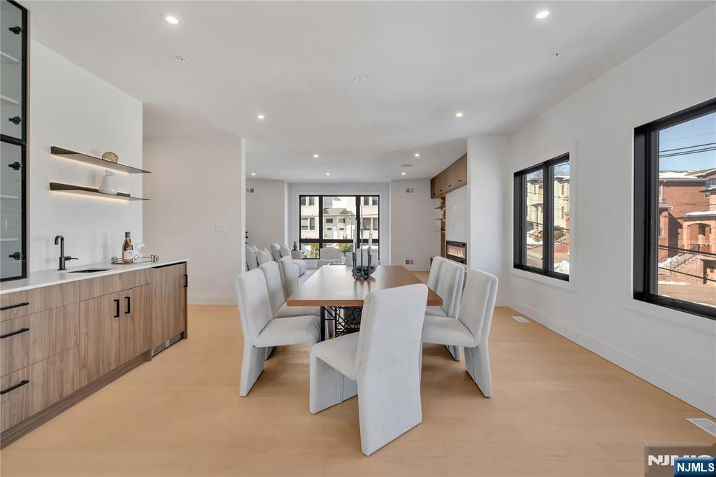 2220 MacKay Avenue, Unit A Fort Lee, NJ 07024 - Photo 11 of 45 a large white kitchen with a large window