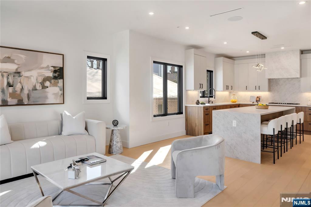 2220 MacKay Avenue, Unit A Fort Lee, NJ 07024 - Photo 12 of 45 a living room with stainless steel appliances furniture and a kitchen view