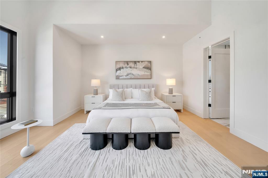 2220 MacKay Avenue, Unit A Fort Lee, NJ 07024 - Photo 20 of 45 a bedroom with a bed and wooden floor