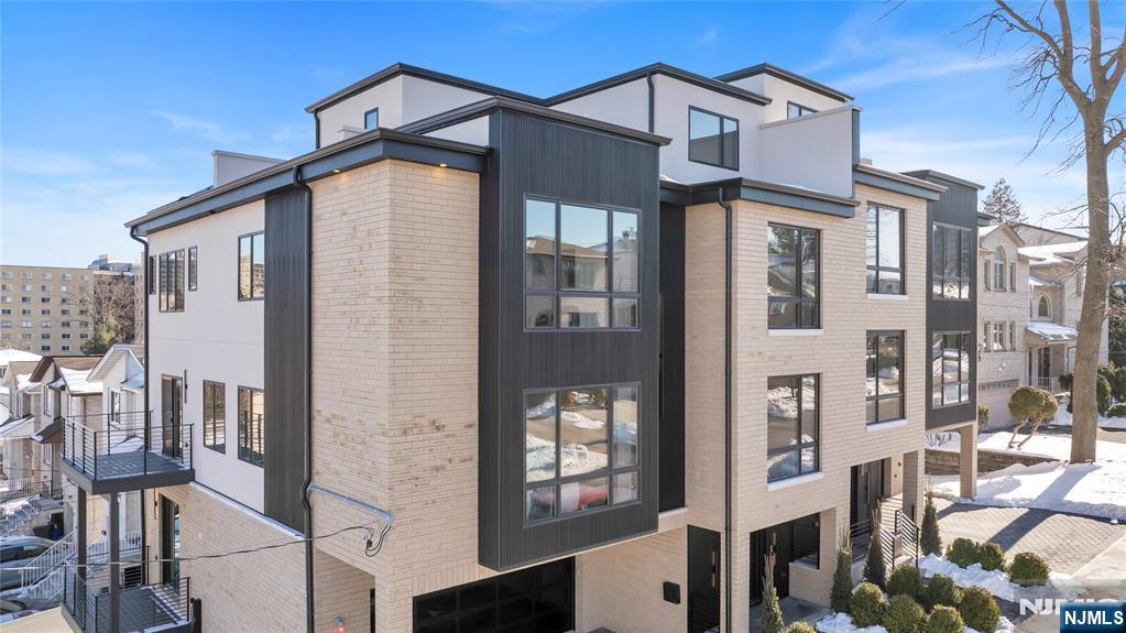 2220 MacKay Avenue, Unit A Fort Lee, NJ 07024 - Photo 2 of 45 a front view of a building with glass windows