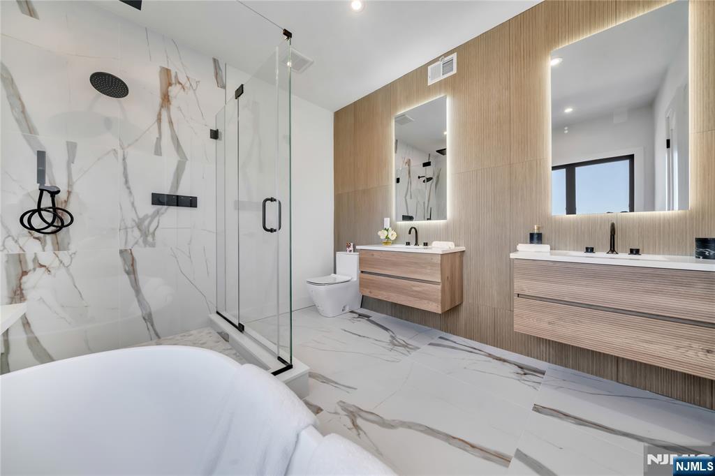 2220 MacKay Avenue, Unit A Fort Lee, NJ 07024 - Photo 22 of 45 a bathroom with a double vanity sink mirror and toilet