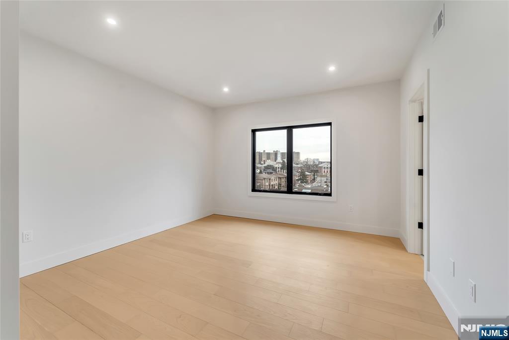 2220 MacKay Avenue, Unit A Fort Lee, NJ 07024 - Photo 23 of 45 an empty room with windows