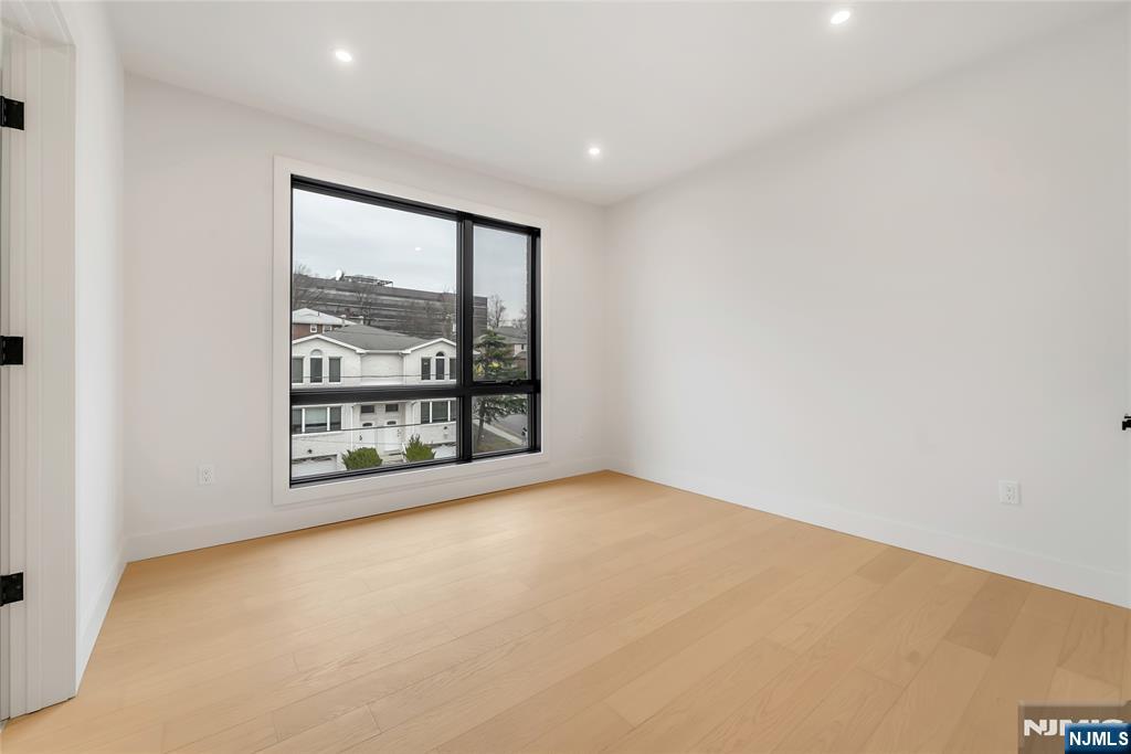 2220 MacKay Avenue, Unit A Fort Lee, NJ 07024 - Photo 29 of 45 an empty room with a window