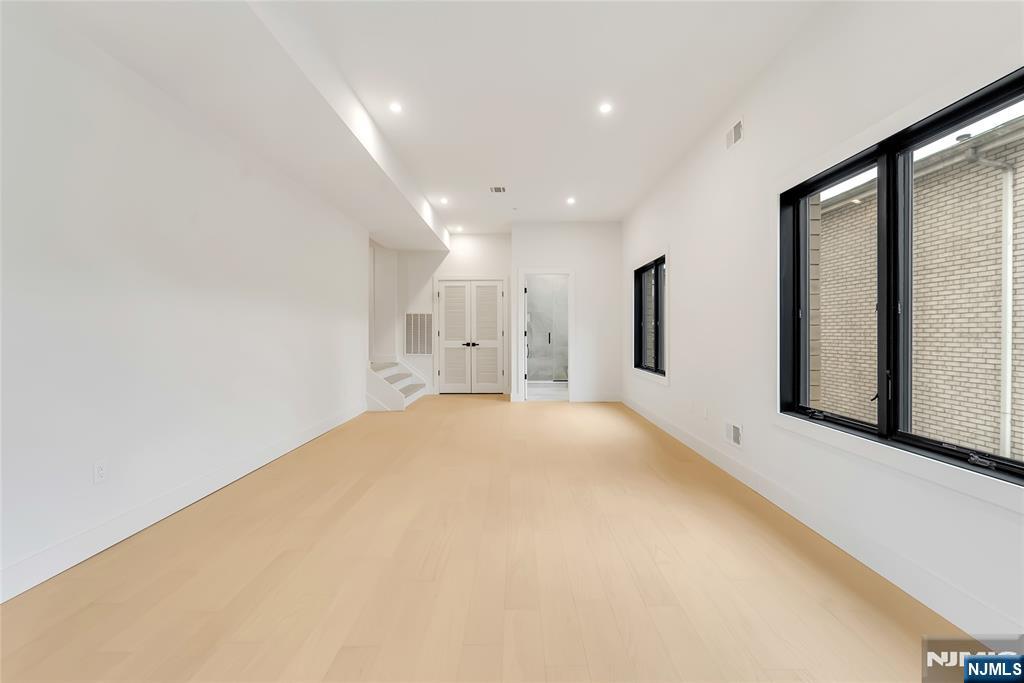 2220 MacKay Avenue, Unit A Fort Lee, NJ 07024 - Photo 39 of 45 a view of an empty room with a window