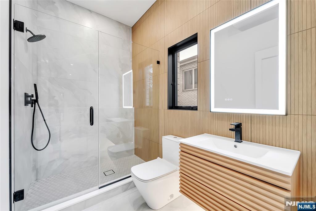 2220 MacKay Avenue, Unit A Fort Lee, NJ 07024 - Photo 41 of 45 a bathroom with a sink toilet and shower