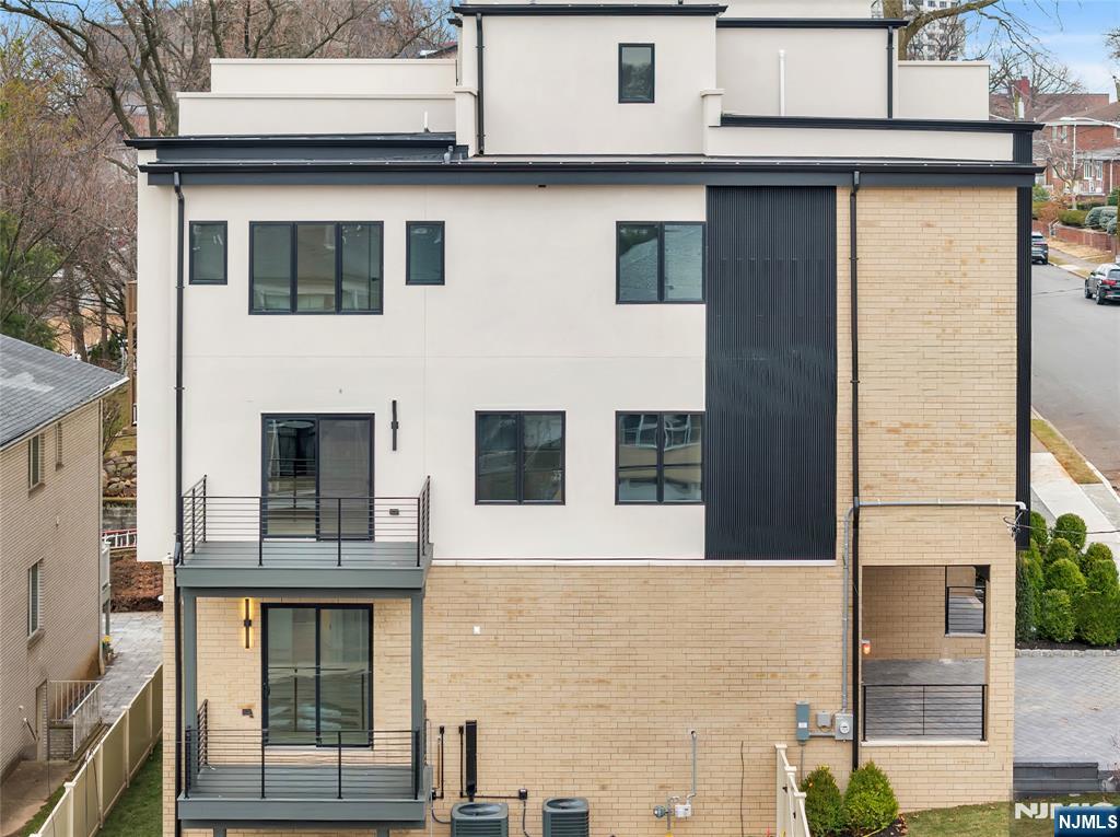 2220 MacKay Avenue, Unit A Fort Lee, NJ 07024 - Photo 44 of 45 a front view of a building with windows