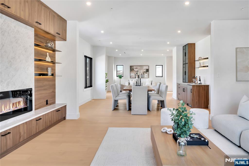 2220 MacKay Avenue, Unit A Fort Lee, NJ 07024 - Photo 7 of 45 a living room with furniture potted plant and kitchen view