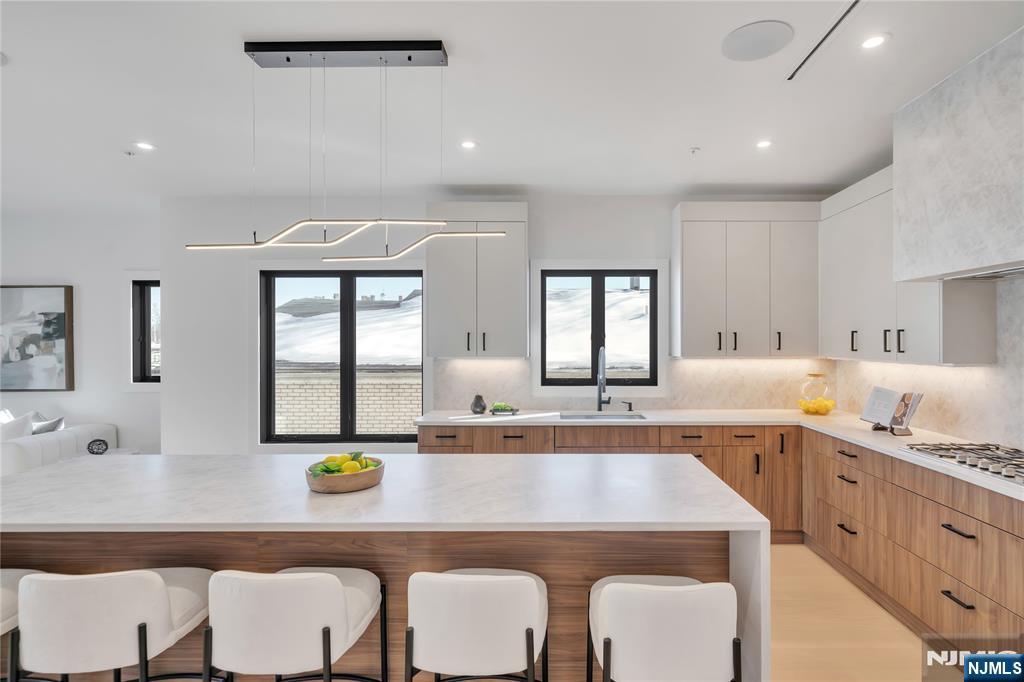 2220 MacKay Avenue, Unit A Fort Lee, NJ 07024 - Photo 10 of 45 a kitchen with a dining table chairs and window