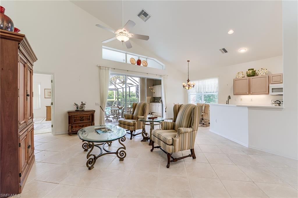 9156 Spring Run Boulevard Estero, FL 34135 - Photo 3 of 34 a living room with furniture and a large window