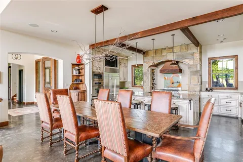 a dining room with furniture window and wooden floor