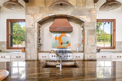 a living room with fireplace furniture and a window