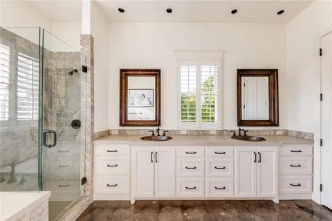 a bathroom with a granite countertop sink mirror and a