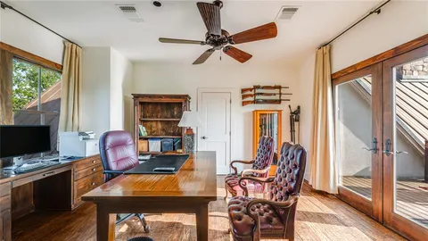 a workspace with furniture and window