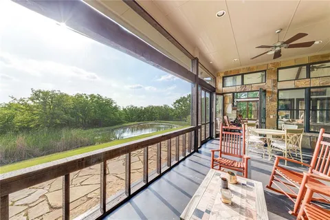 a view of balcony with furniture