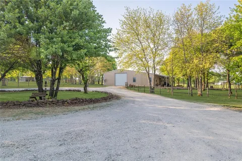 a view of a house with a big yard