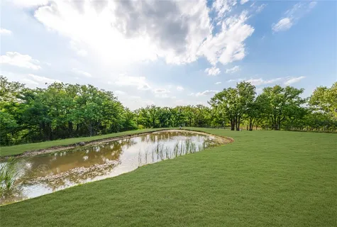 a view of a lake from a yard