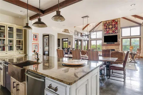 a kitchen with stainless steel appliances granite countertop a stove and a sink