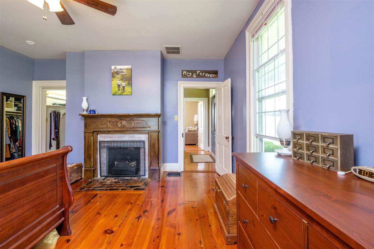 3557 Shutterlee Mill Road Staunton, VA 24401 - Photo 12 of 42 a living room with stainless steel appliances granite countertop furniture a fireplace and a window