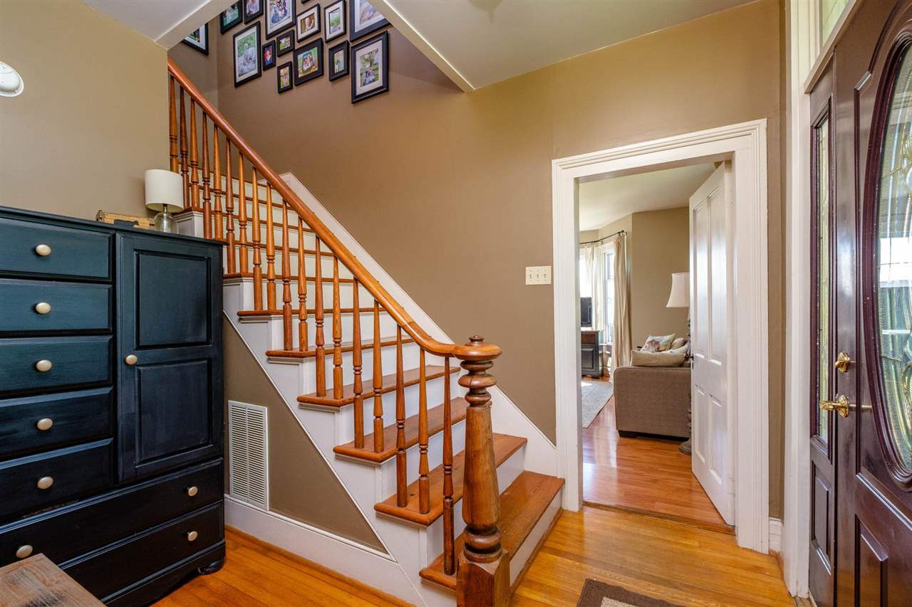 3557 Shutterlee Mill Road Staunton, VA 24401 - Photo 16 of 42 a view of a hallway with wooden floor and staircase