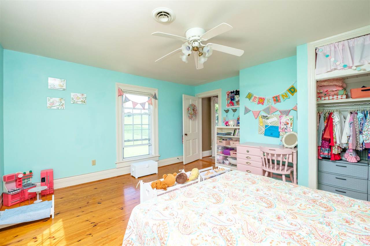 3557 Shutterlee Mill Road Staunton, VA 24401 - Photo 20 of 42 a bedroom with a bed cabinets and window