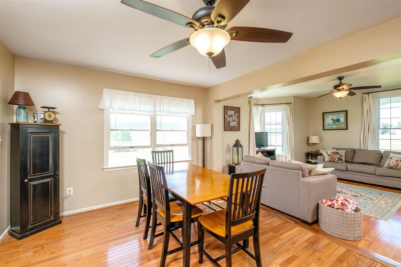 3557 Shutterlee Mill Road Staunton, VA 24401 - Photo 6 of 42 a view of a dining room with furniture window and wooden floor