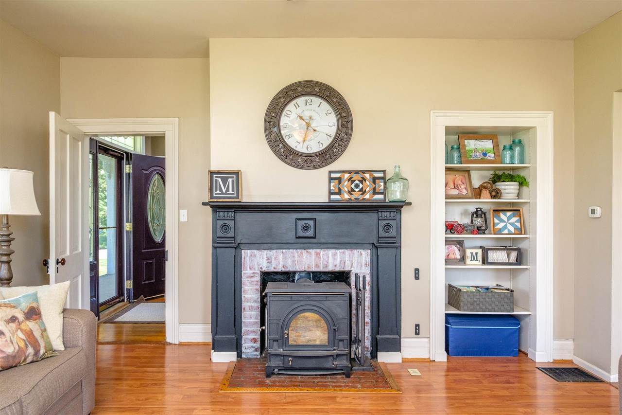 3557 Shutterlee Mill Road Staunton, VA 24401 - Photo 9 of 42 a living room with furniture and a fireplace