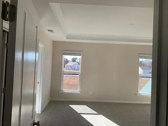a view of an empty room and window