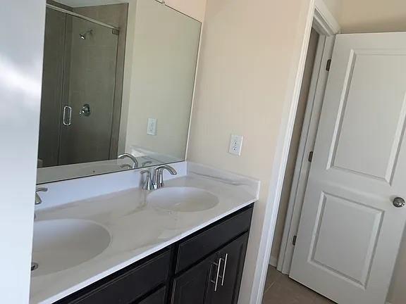 2770 Port Bow Lane Cumming, GA 30041 - Photo 14 of 20 a bathroom with a sink and a mirror